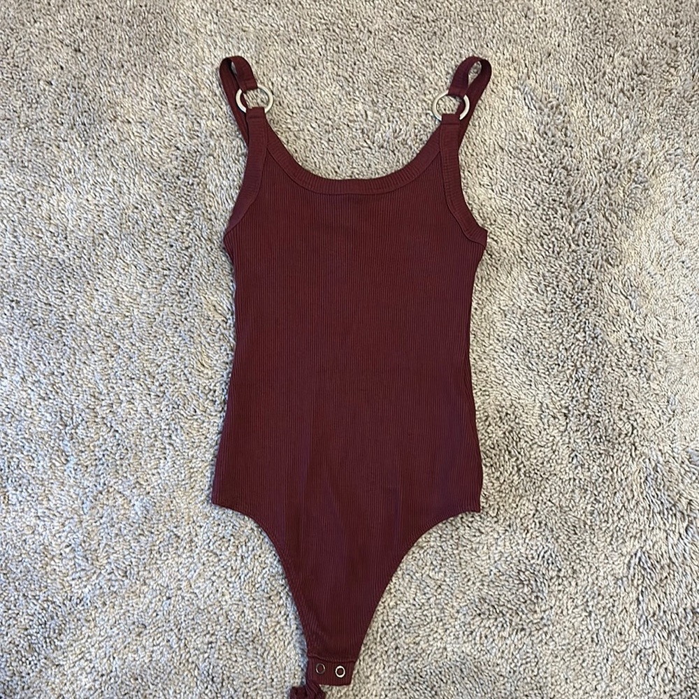 Maroon body suit with silver detailing
